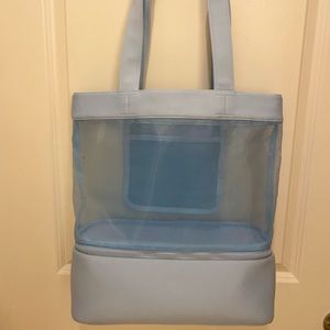 Light blue beach bag , mesh top and cooler like compartment underneath